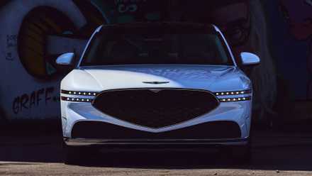 2025 Genesis G90 in white parked against wall