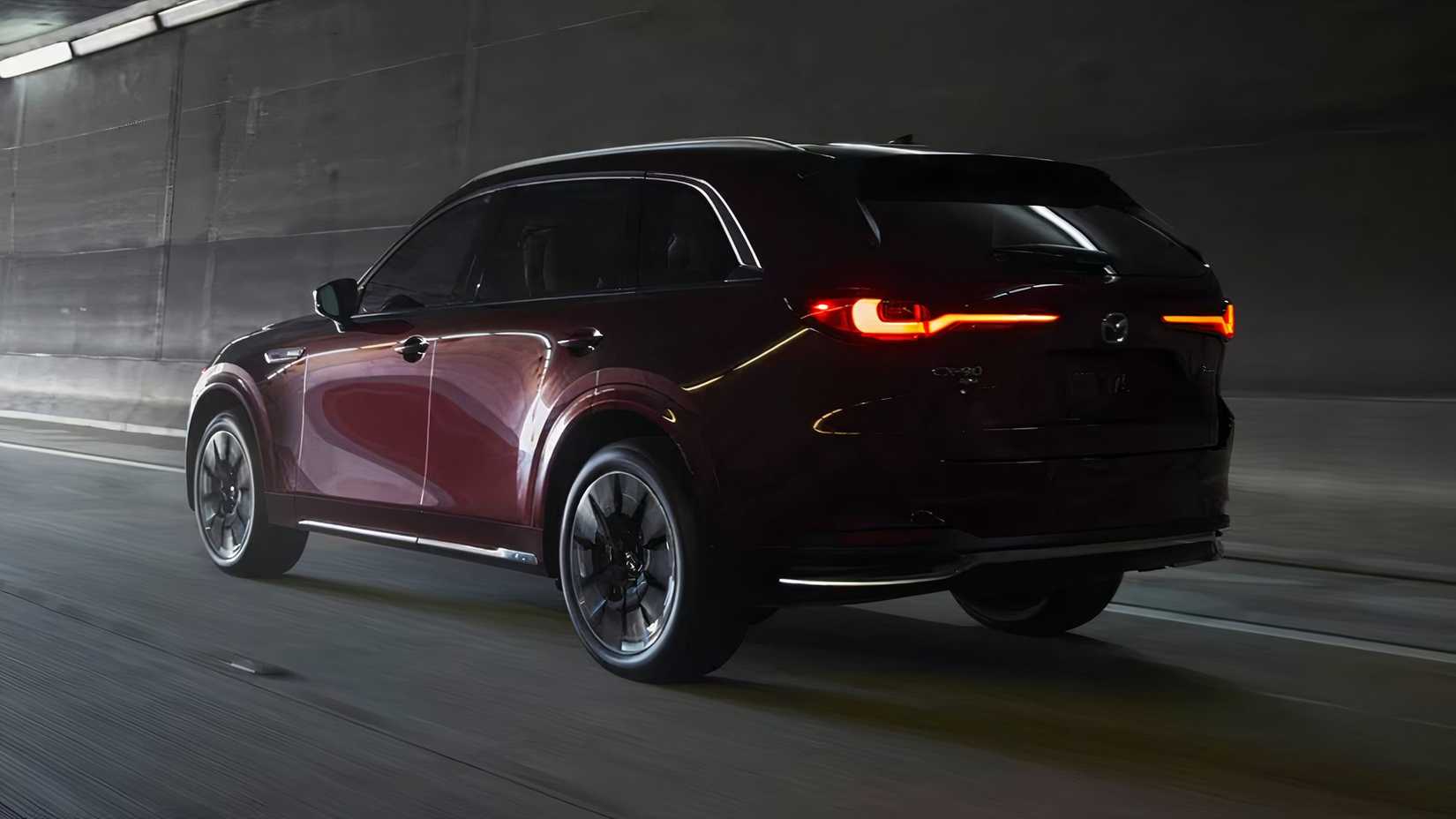 2025 Mazda CX-90 3.3 Turbo S Premium Plus in maroon driving through tunnel