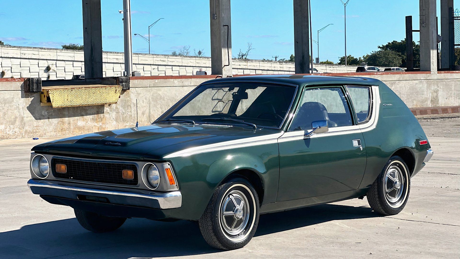1970 AMC Gremlin in green parked