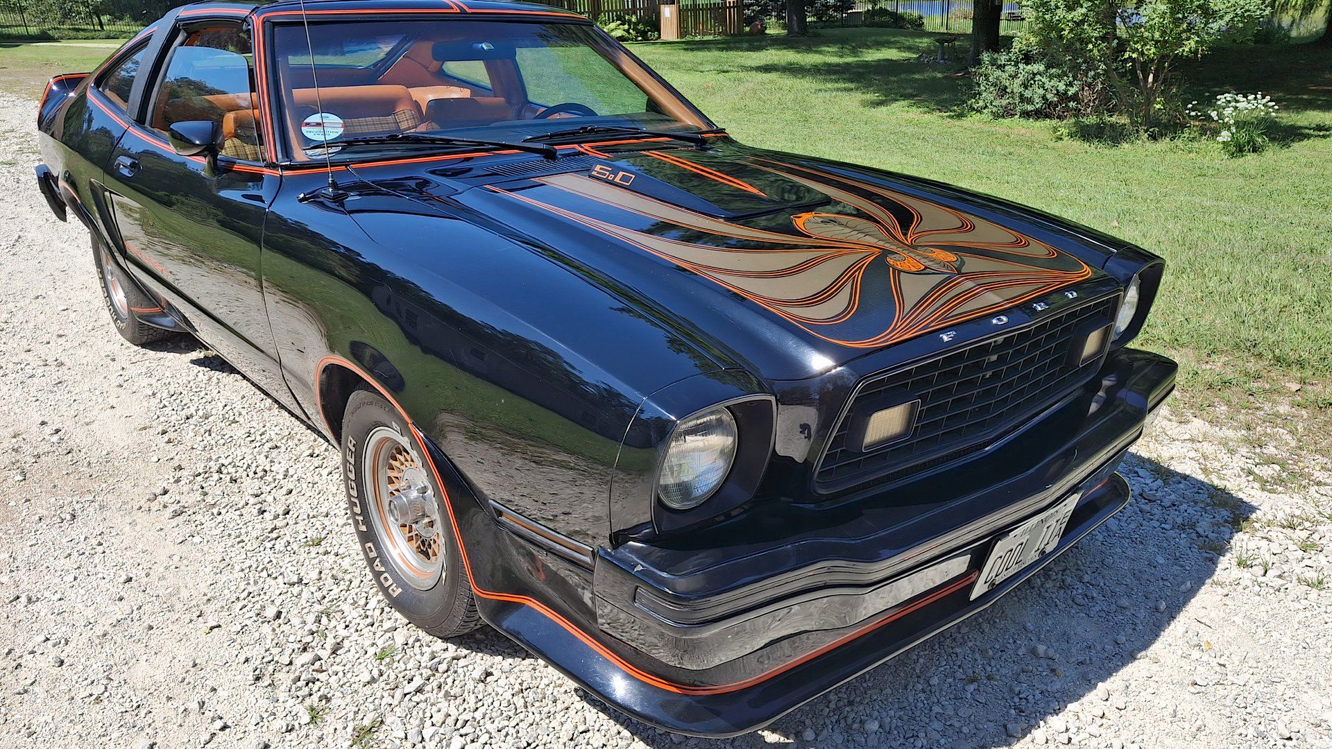1978 Ford Mustang King Corba in black parked on gravel road