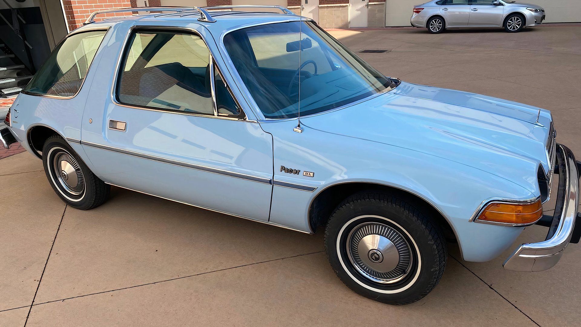 1979 AMC Pacer in light blue parked in parking lot