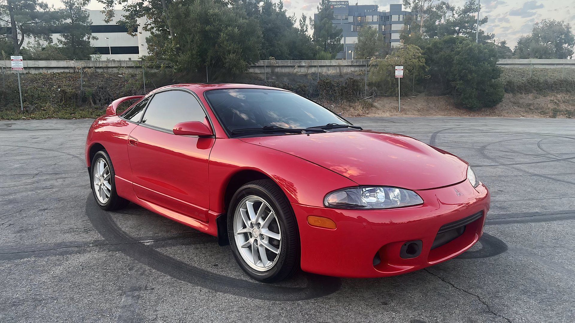 1998 Mitsubishi Eclipse GSX in red parked in parking lot