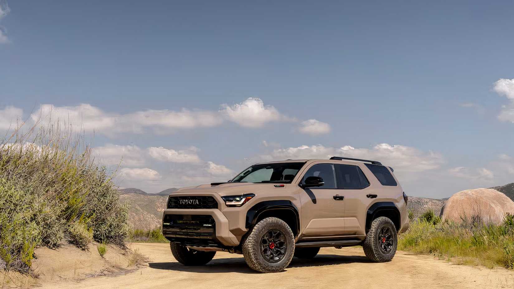 2025 Toyota 4Runner TRD PRO in brown parked on dirt road