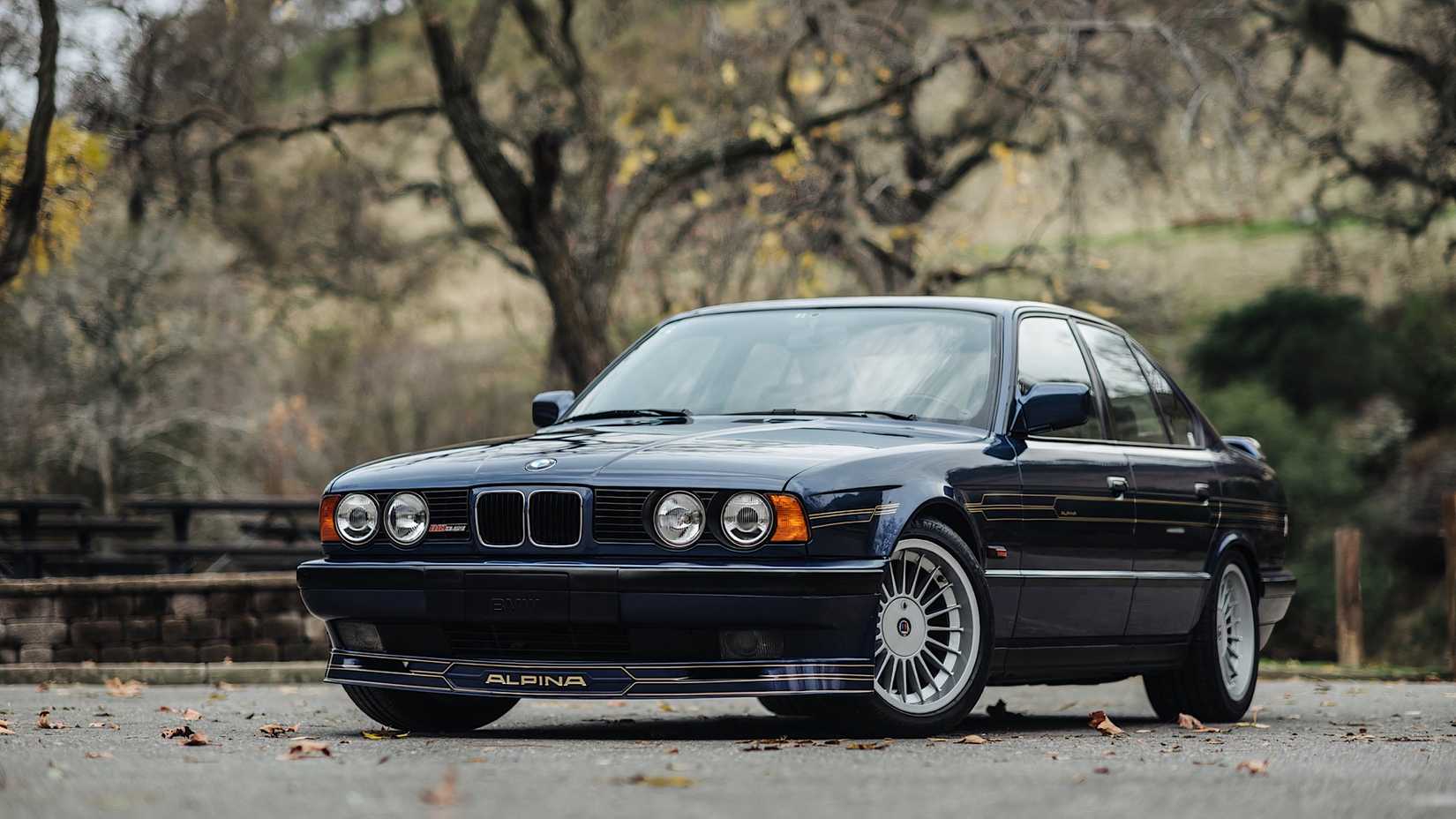1989 Alpina B10 in blue parked in parking lot