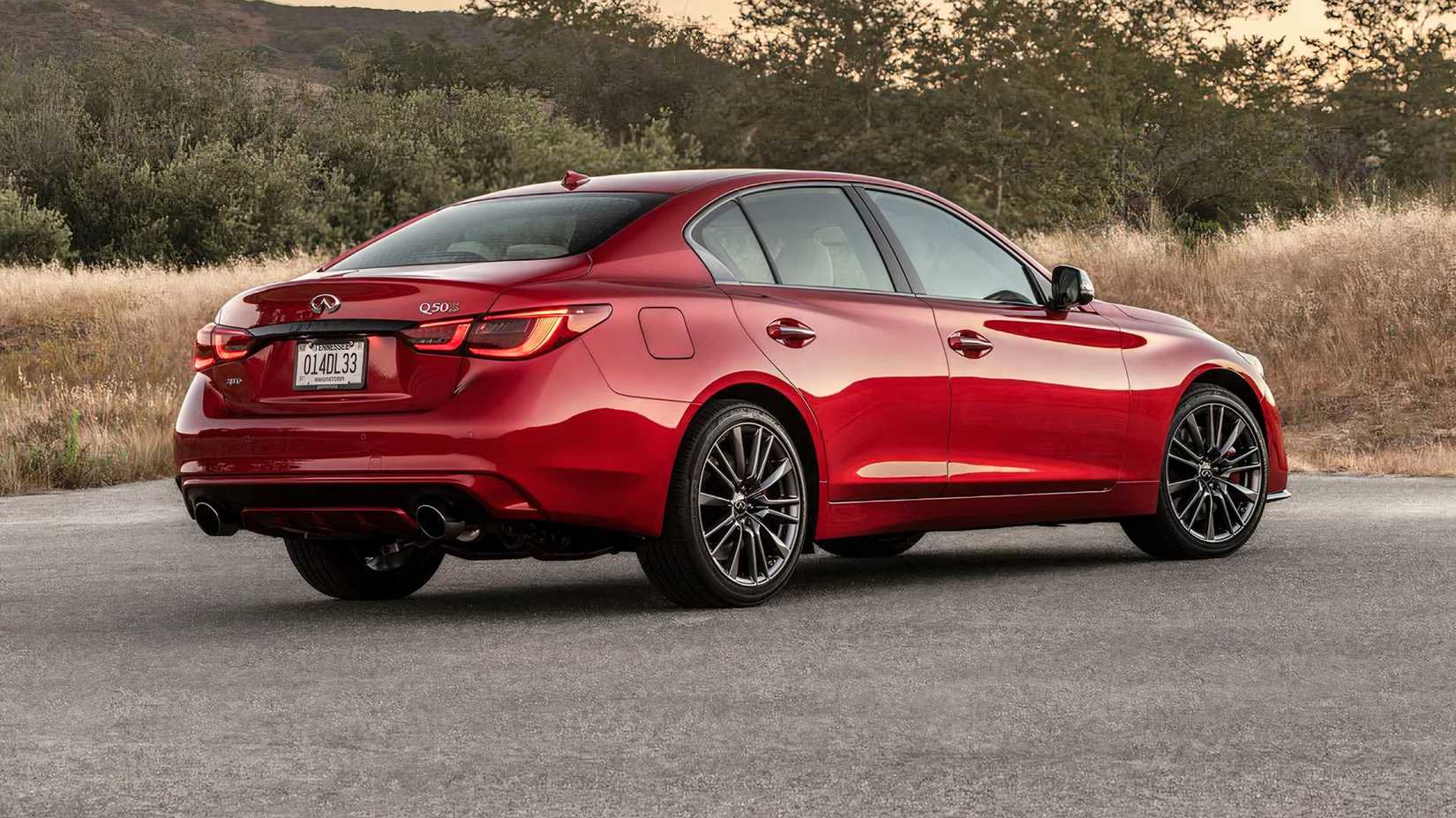 2024 Infiniti Q50 Red Sport 400 in red parked on street