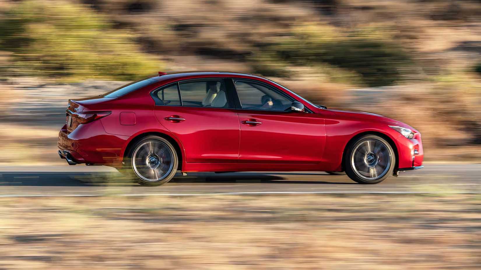 2024 Infiniti Q50 Red Sport 400 in red driving on country road