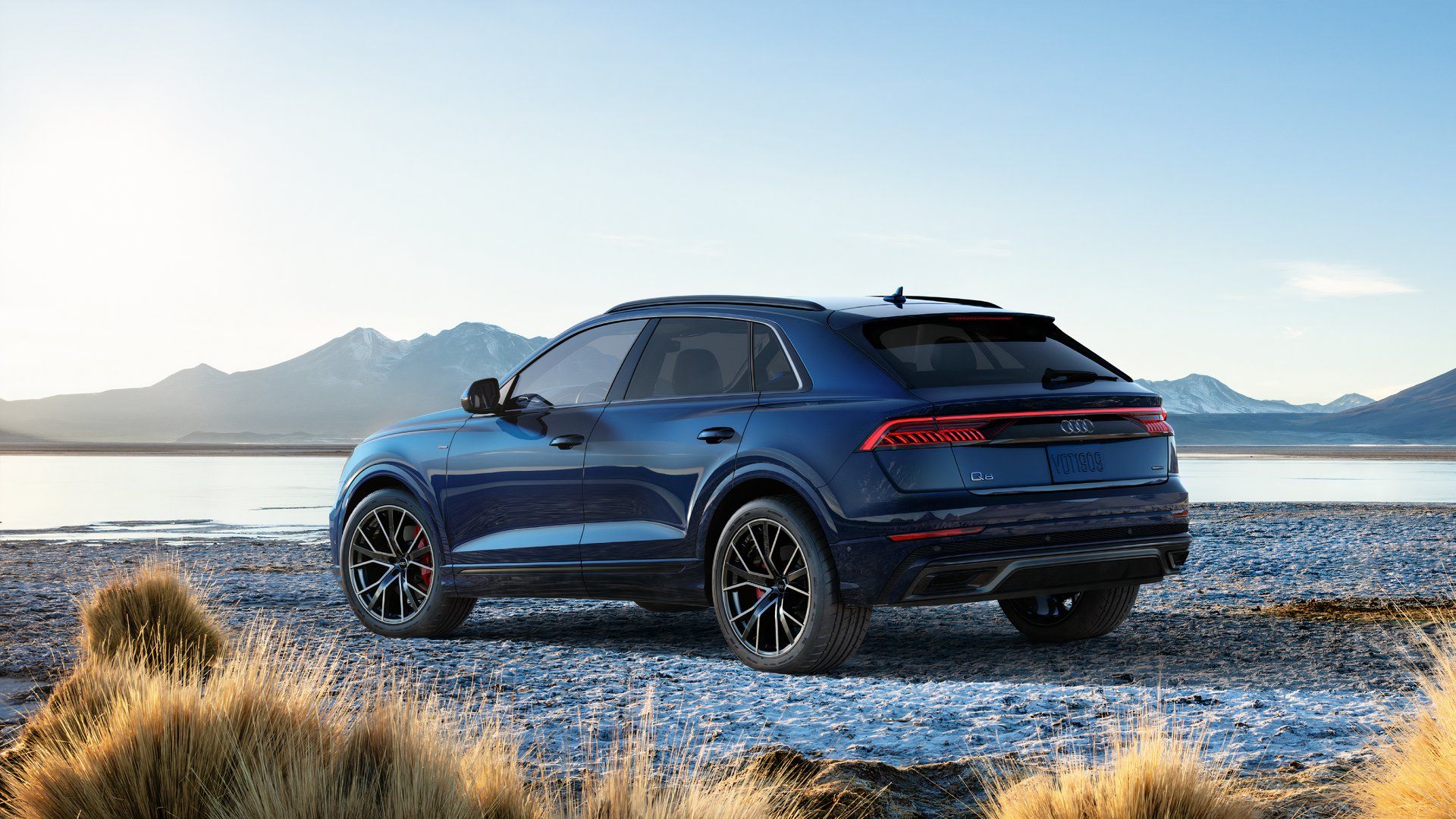 Rear three-quarters shot of a blue 2019 Audi Q8