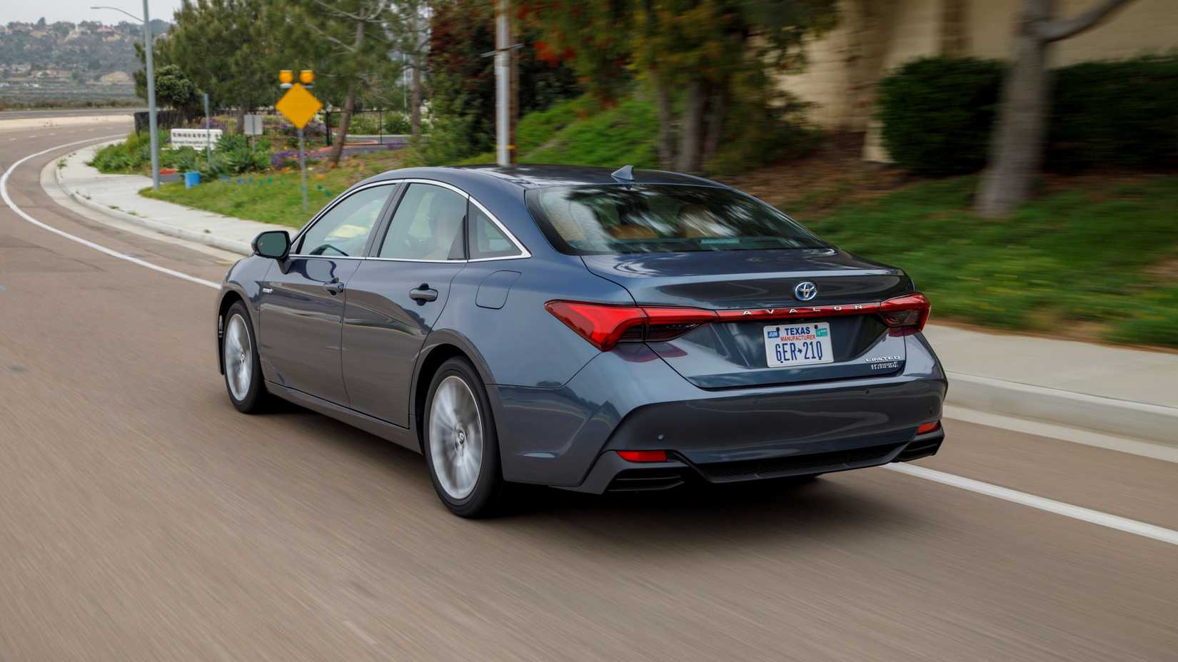 2019 Toyota Avalon Hybrid Limited Driving Rear Three-Quarter