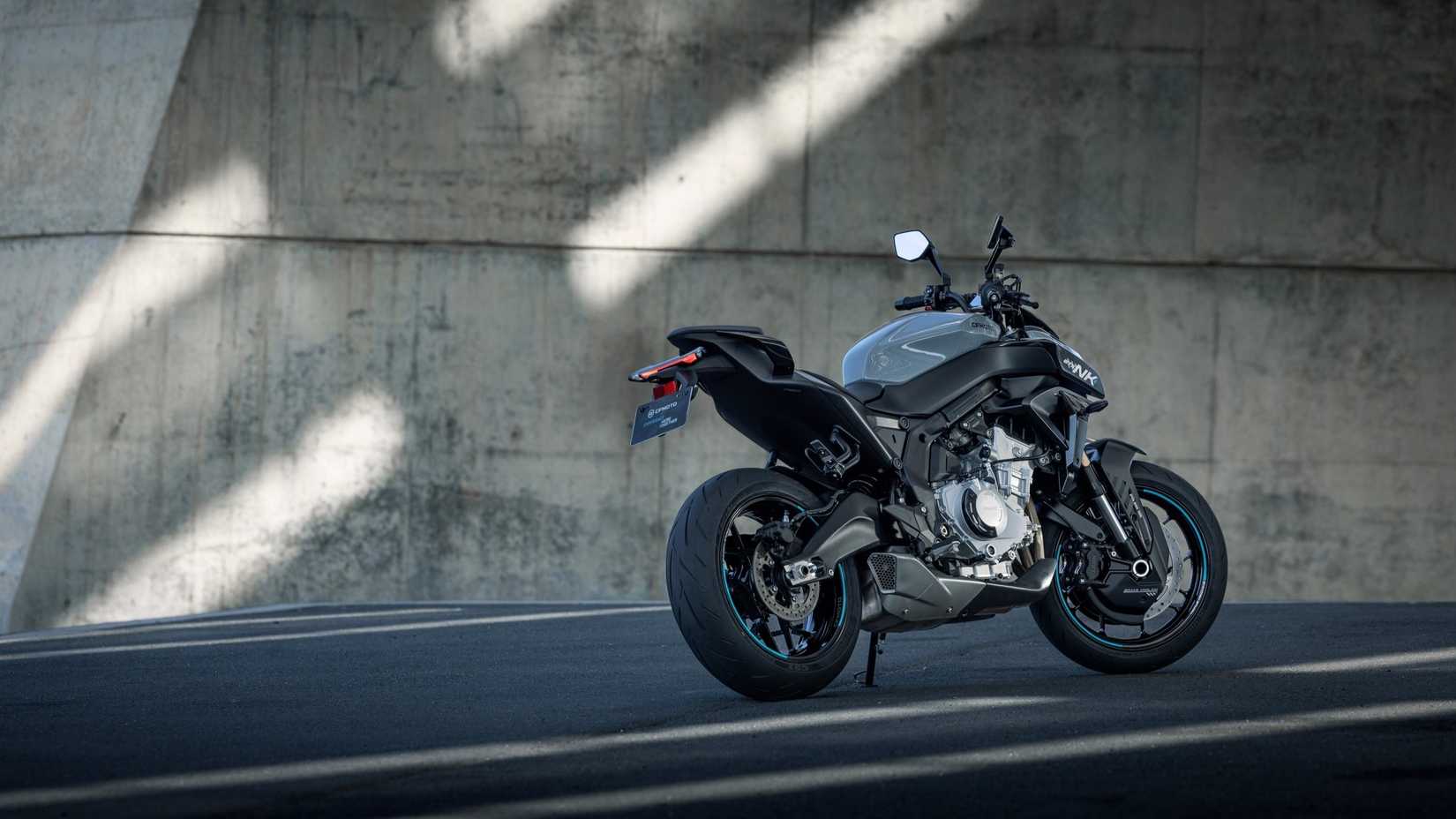 Static shot of a gray 2025 CFMoto 675NK parked on its side stand