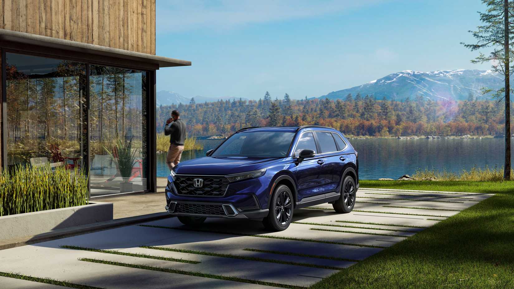 2025 Honda CR-V em azul estacionado próximo à casa do lago