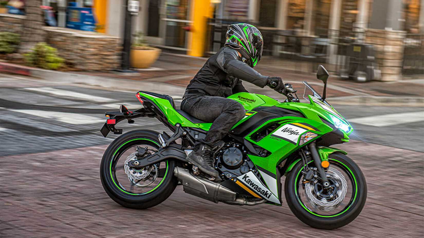 An action short of the 2025 Kawasaki Ninja 650 leaning