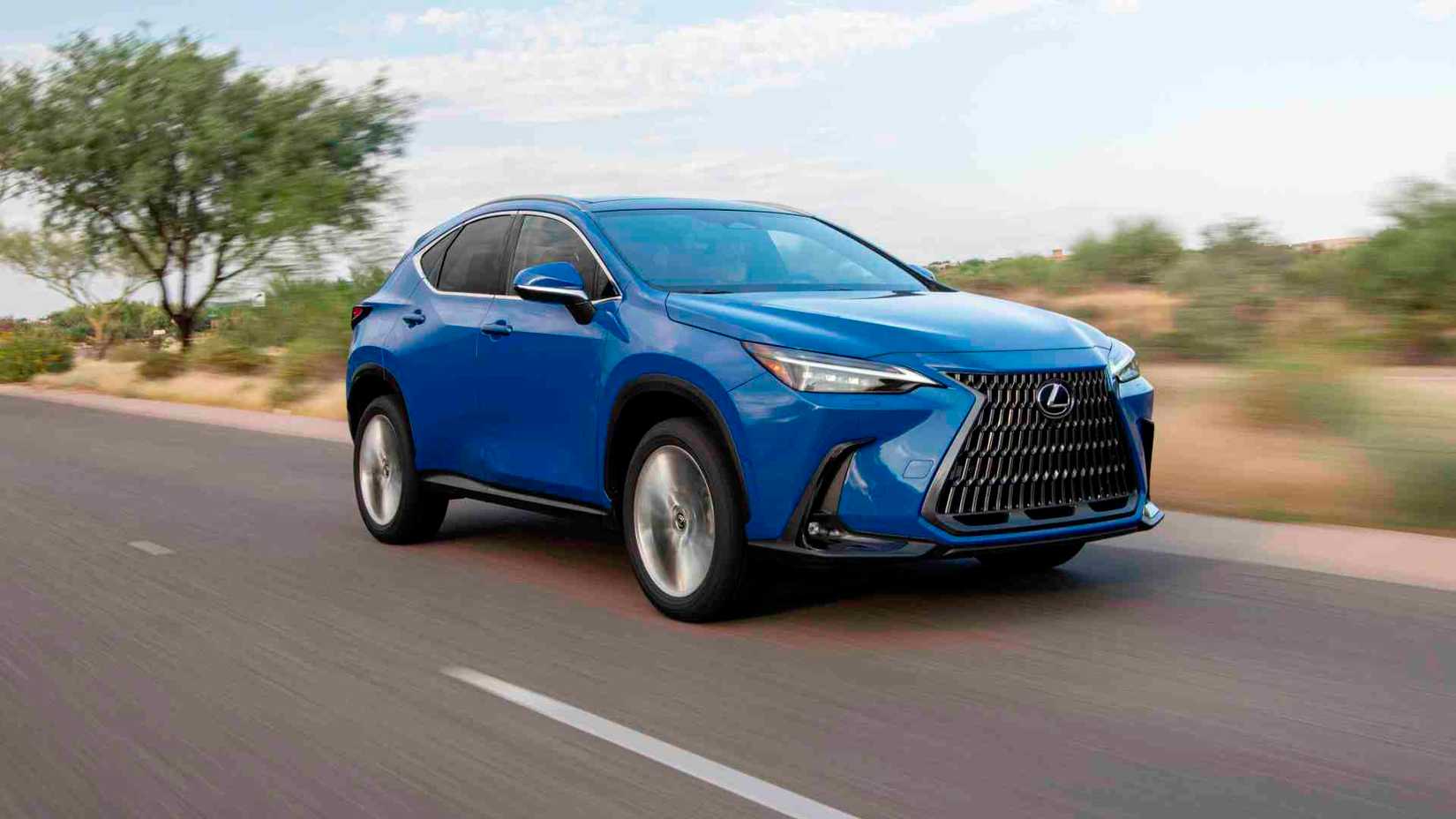 A dynamic front-quarter tracking shot of a blue 2025 Lexus NX 350h driving