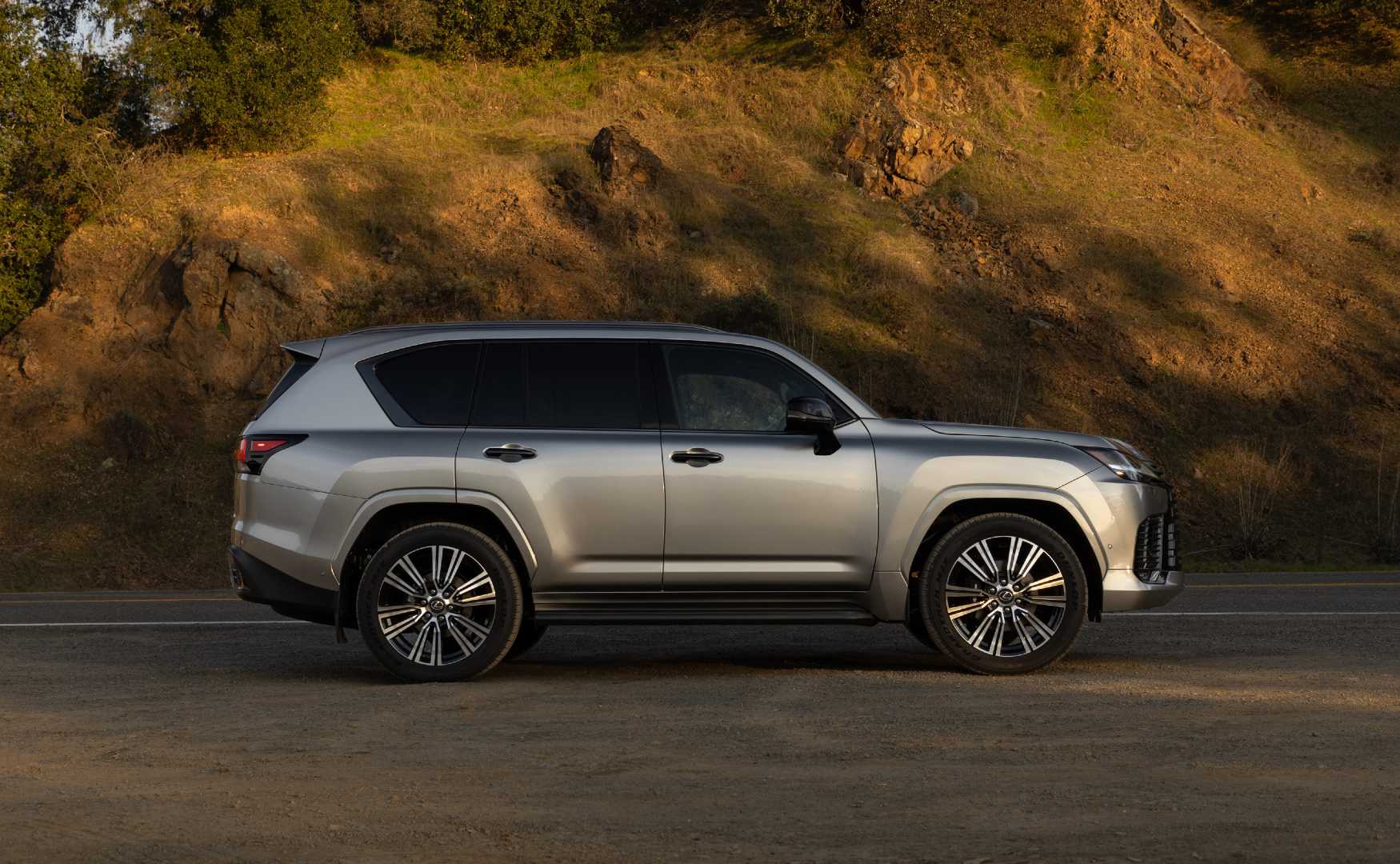 2025 Lexus LX 700h Luxury Atomic Silver side shot parked