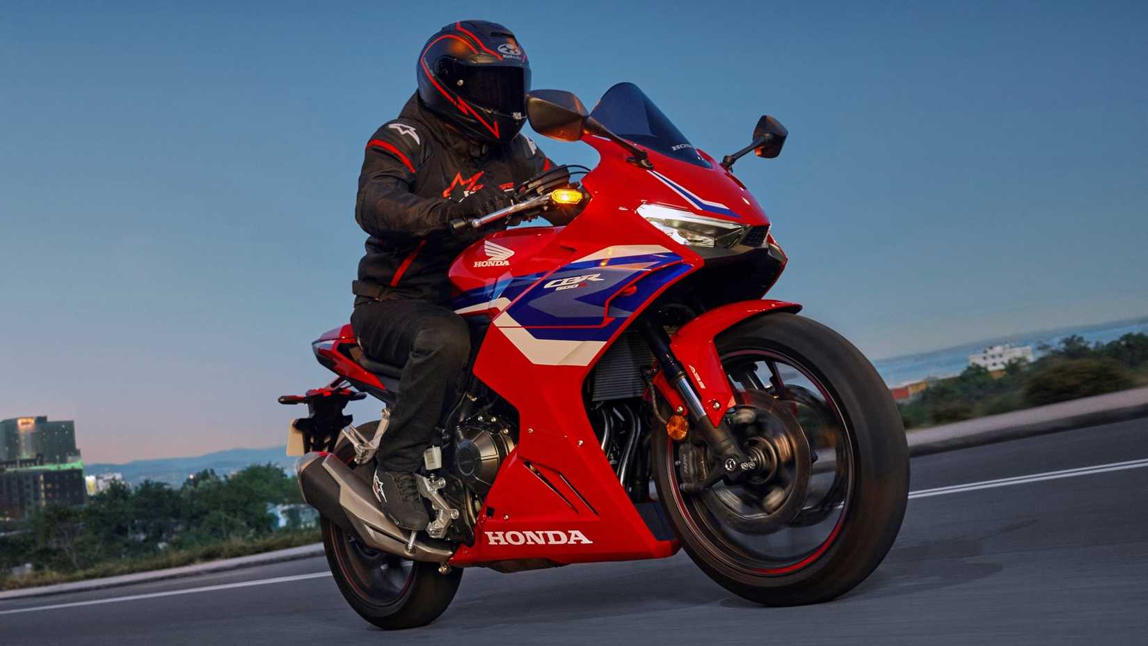 2025 Honda CBR500R accelerating front third quarter view