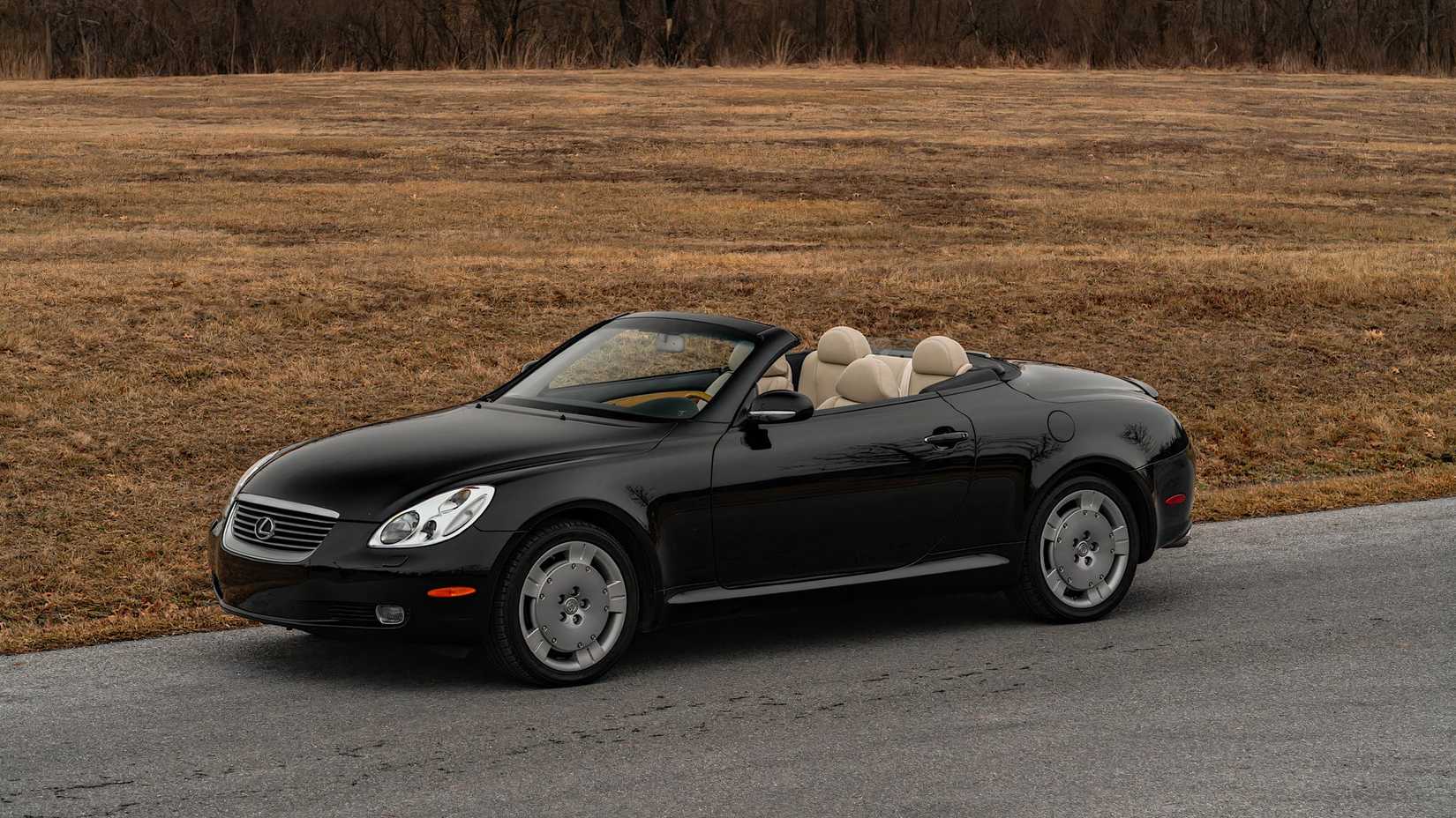 2002 Lexus SC430 in black parked on road