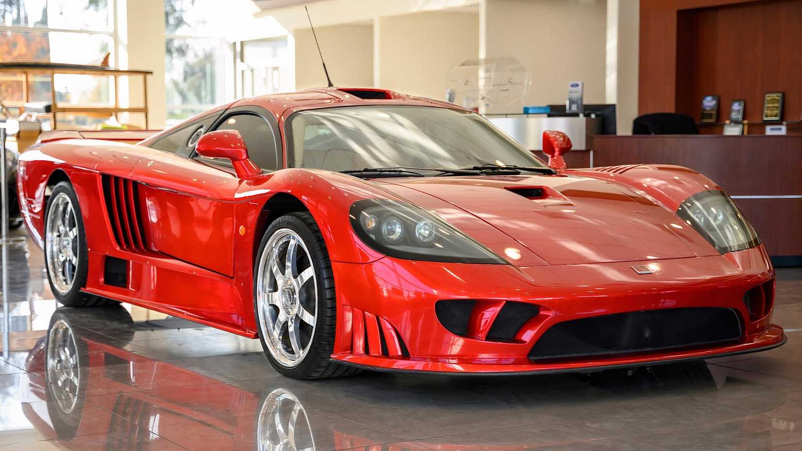 2003 Saleen S7 in red parked in showroom