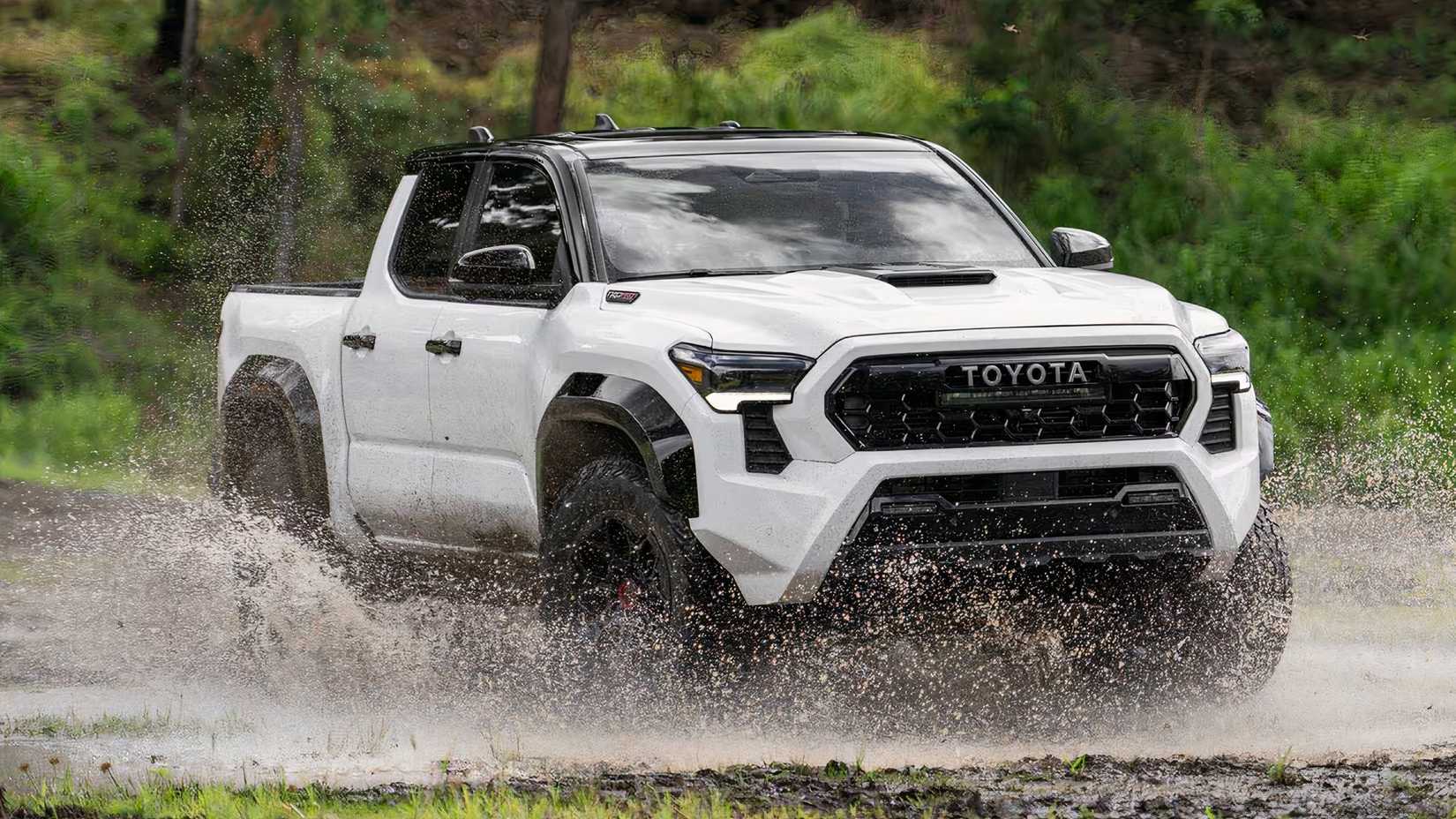 2025 Toyota Tacoma TRD Pro Crew Cab in white driving through a river