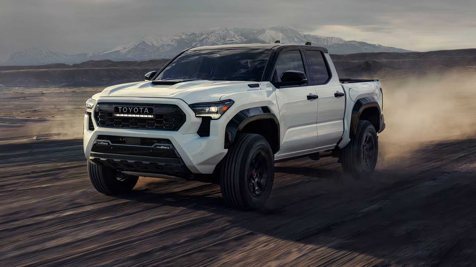 2025 Toyota Tacoma TRD Pro Crew Cab in white driving across desert