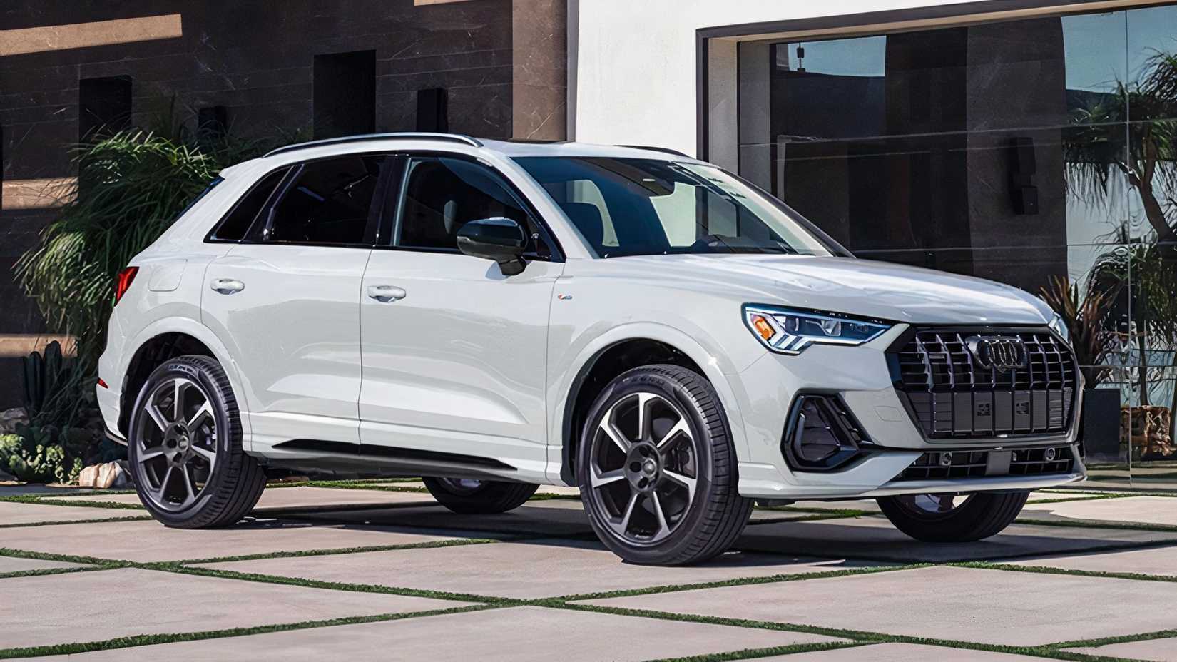 2025 Audi Q3 in white parked outside building