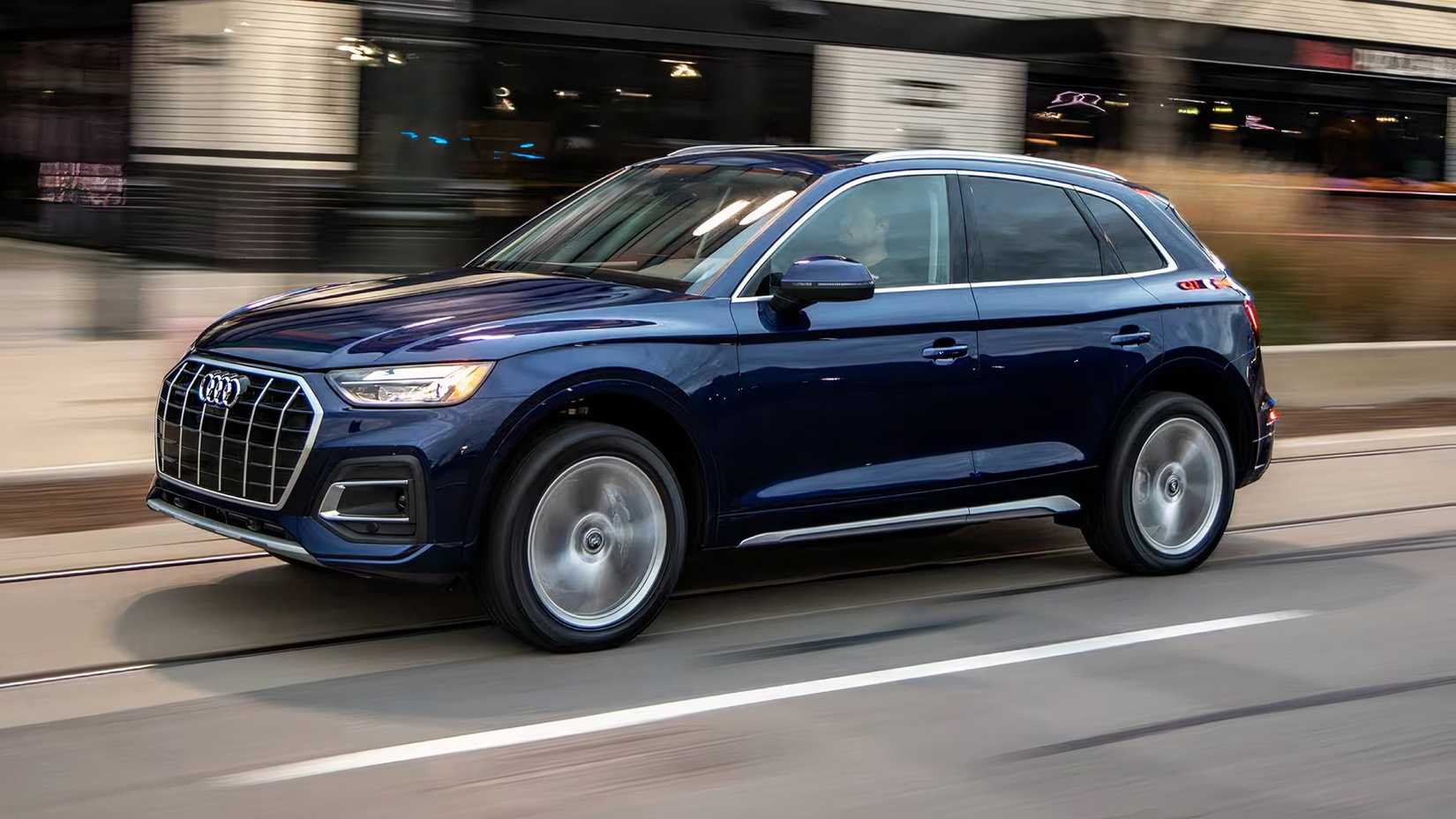 2025 Audi Q5 in blue driving on road