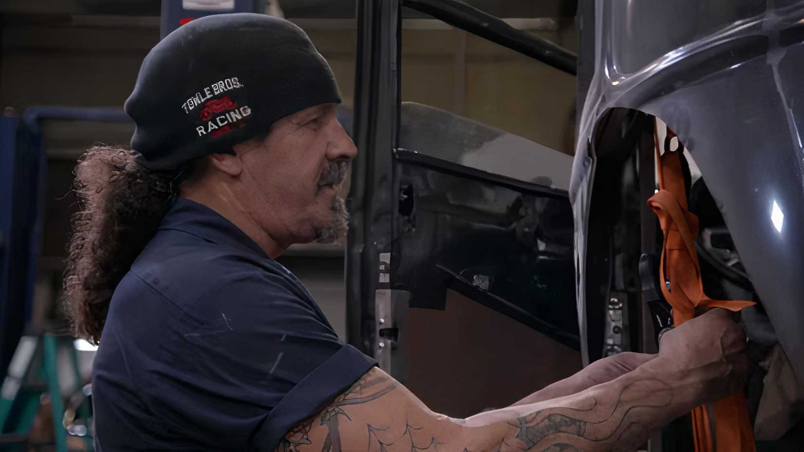 Shot of Mark Towle working on a car
