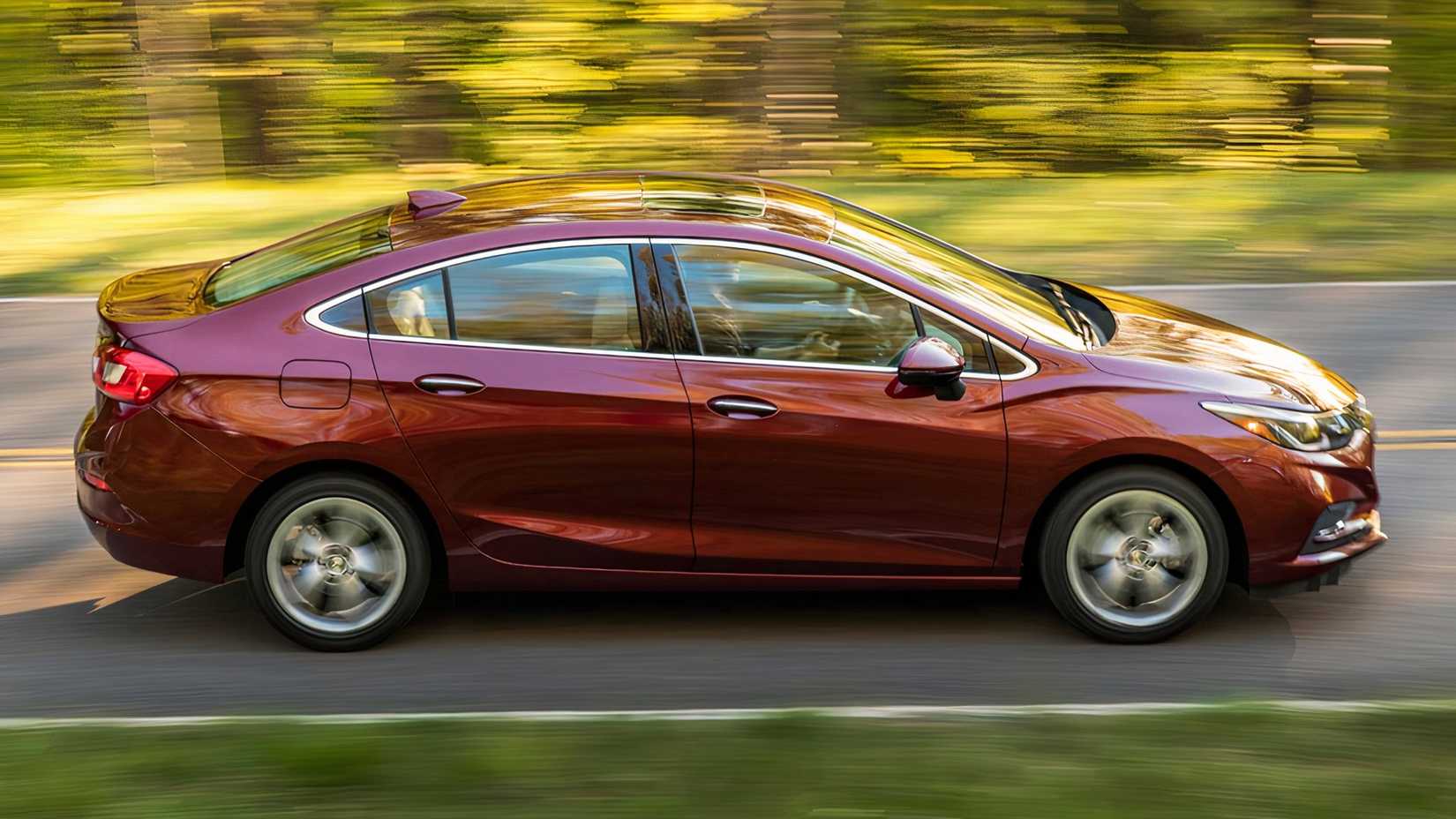 2017 Chevrolet Cruze in maroon driving on road