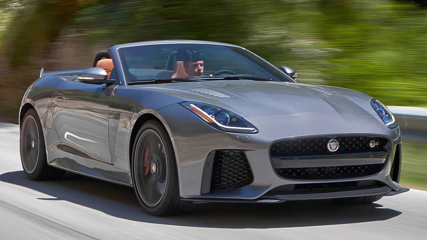 2017 Jaguar F-Type in gray driving with roof down