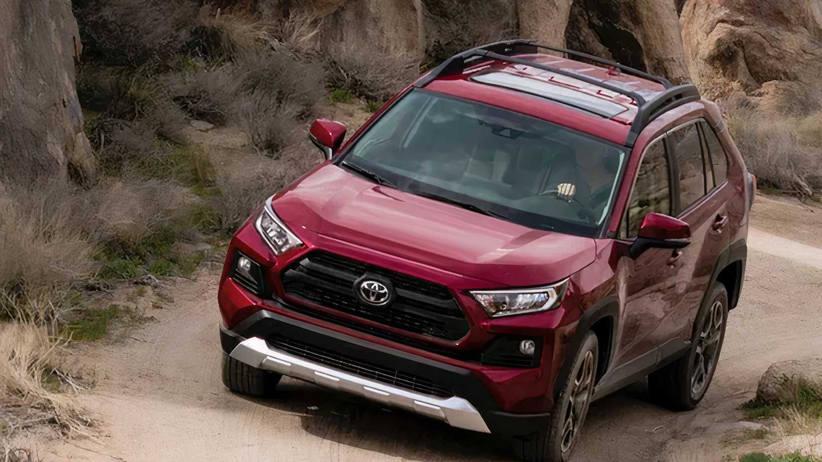 2020 Toyota RAV4 in red driving off-road