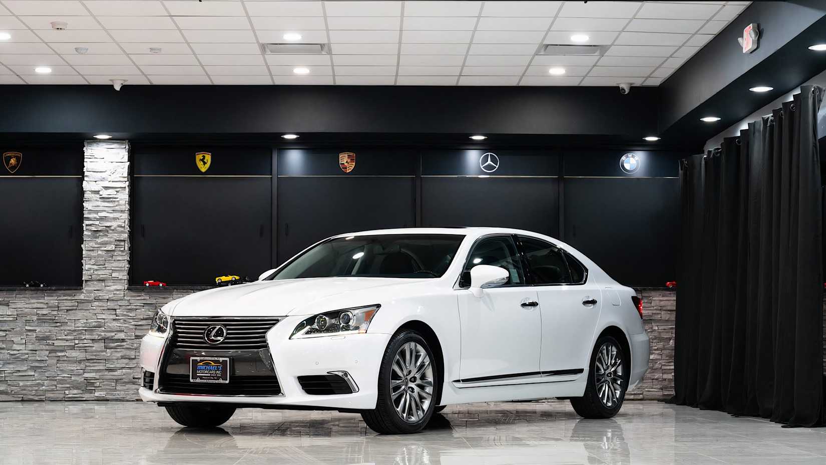 2014 Lexus LS460 in white parked in studio