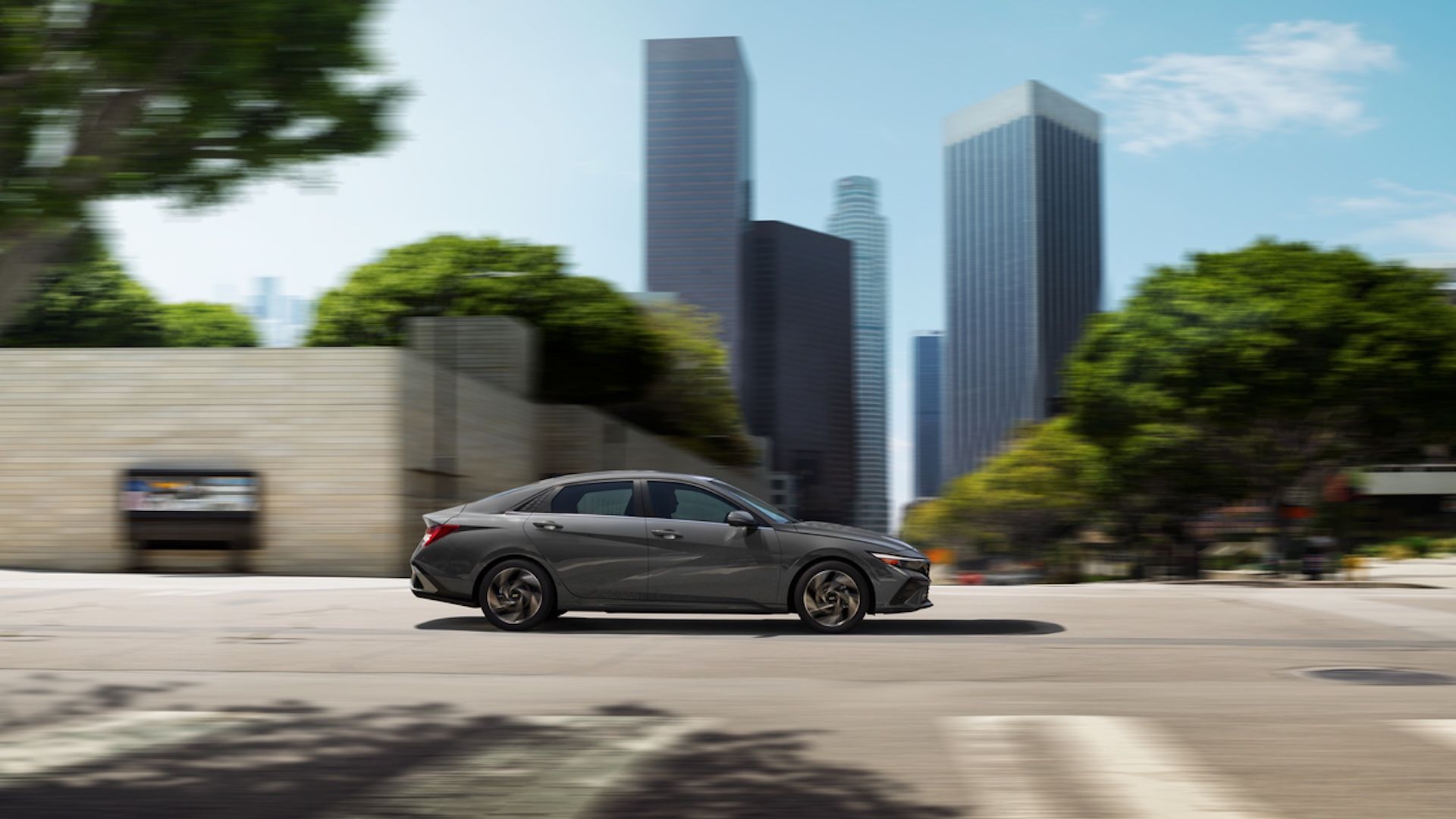 Hyundai Elantra Hybrid driving on road from side