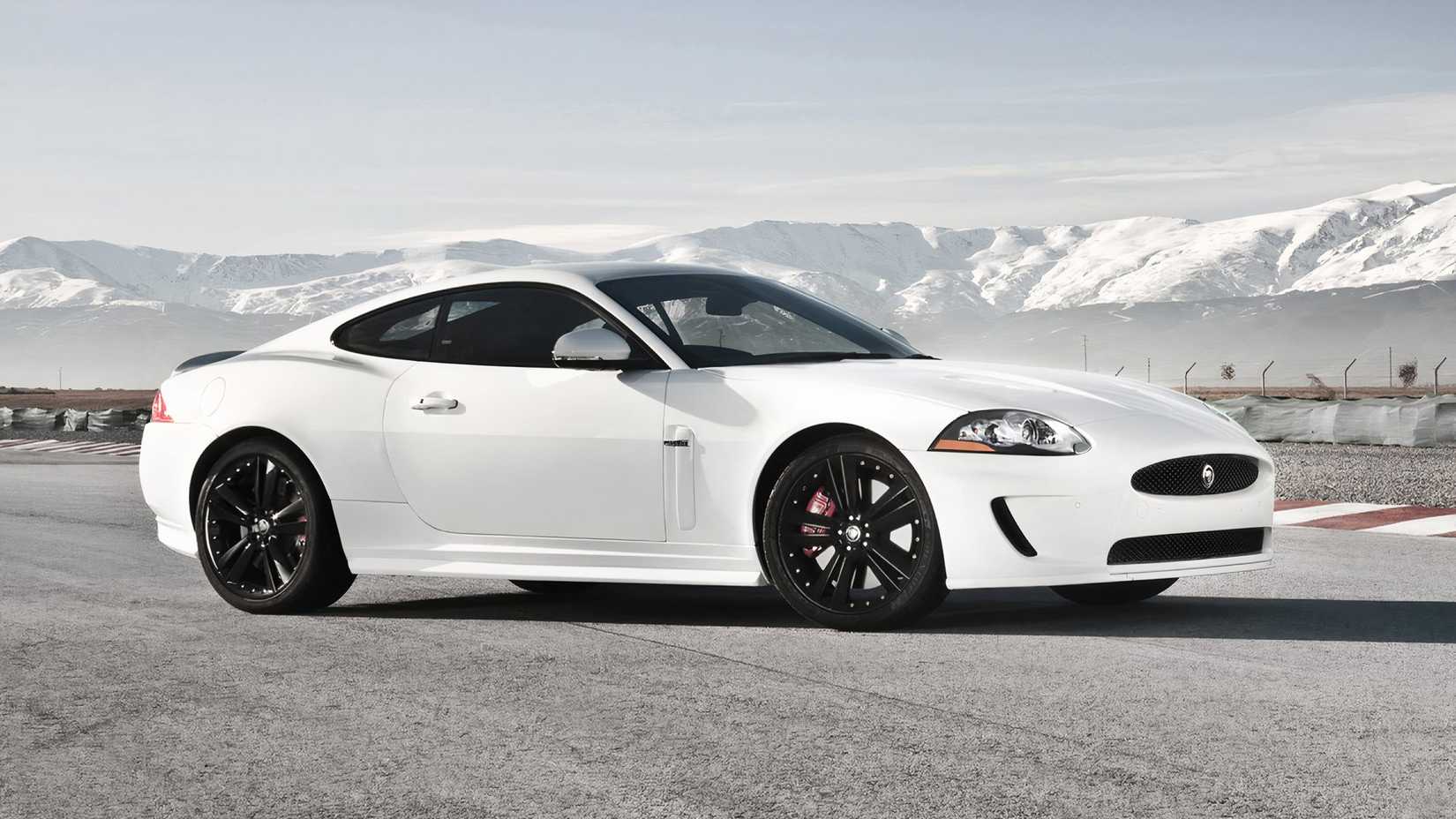 Side shot of a white 2011 Jaguar XKR parked at track