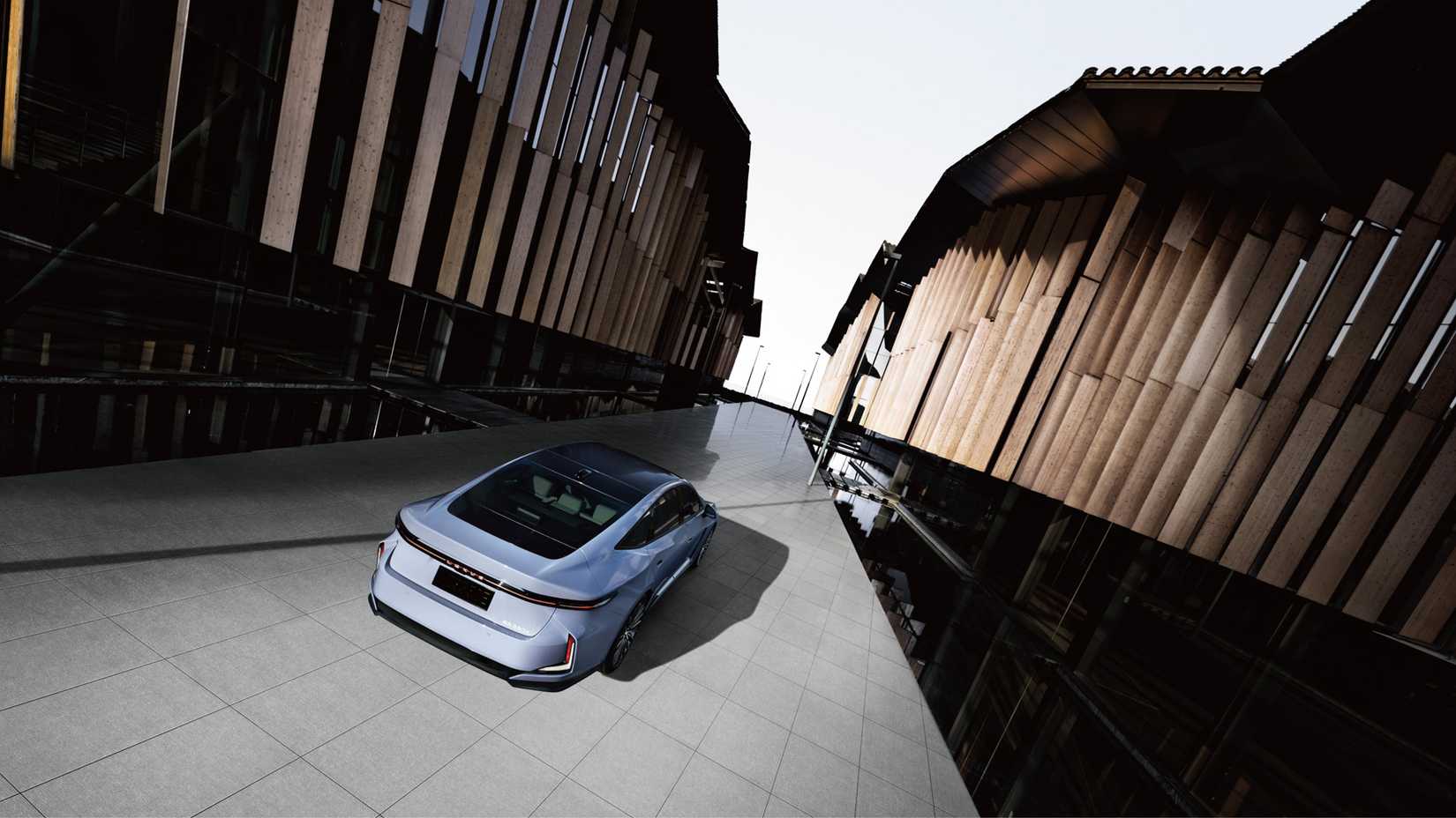 O tiro traseiro do Lexus ES ariel 2026 acelerando entre edifícios