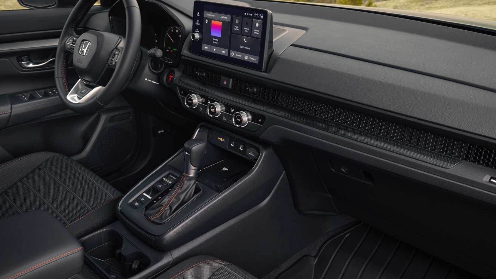 Foto do interior da cabine dianteira de um Honda CR-V TrailSport Hybrid 2026