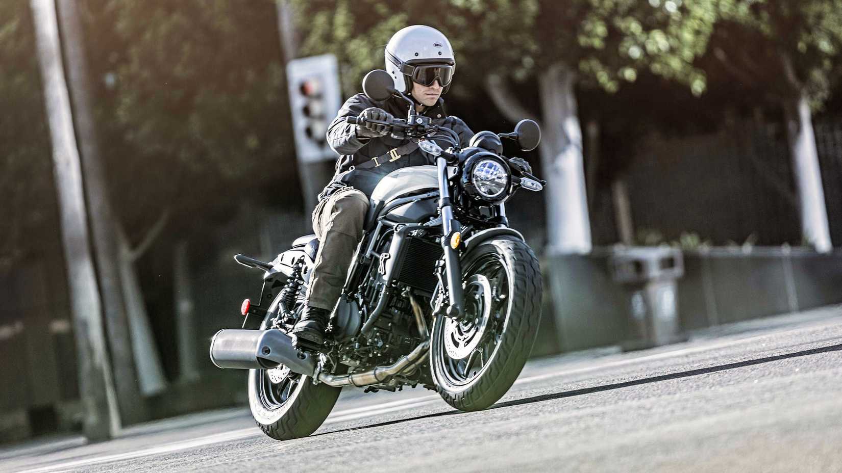 White 2024 Kawasaki Eliminator 450 cruising through town