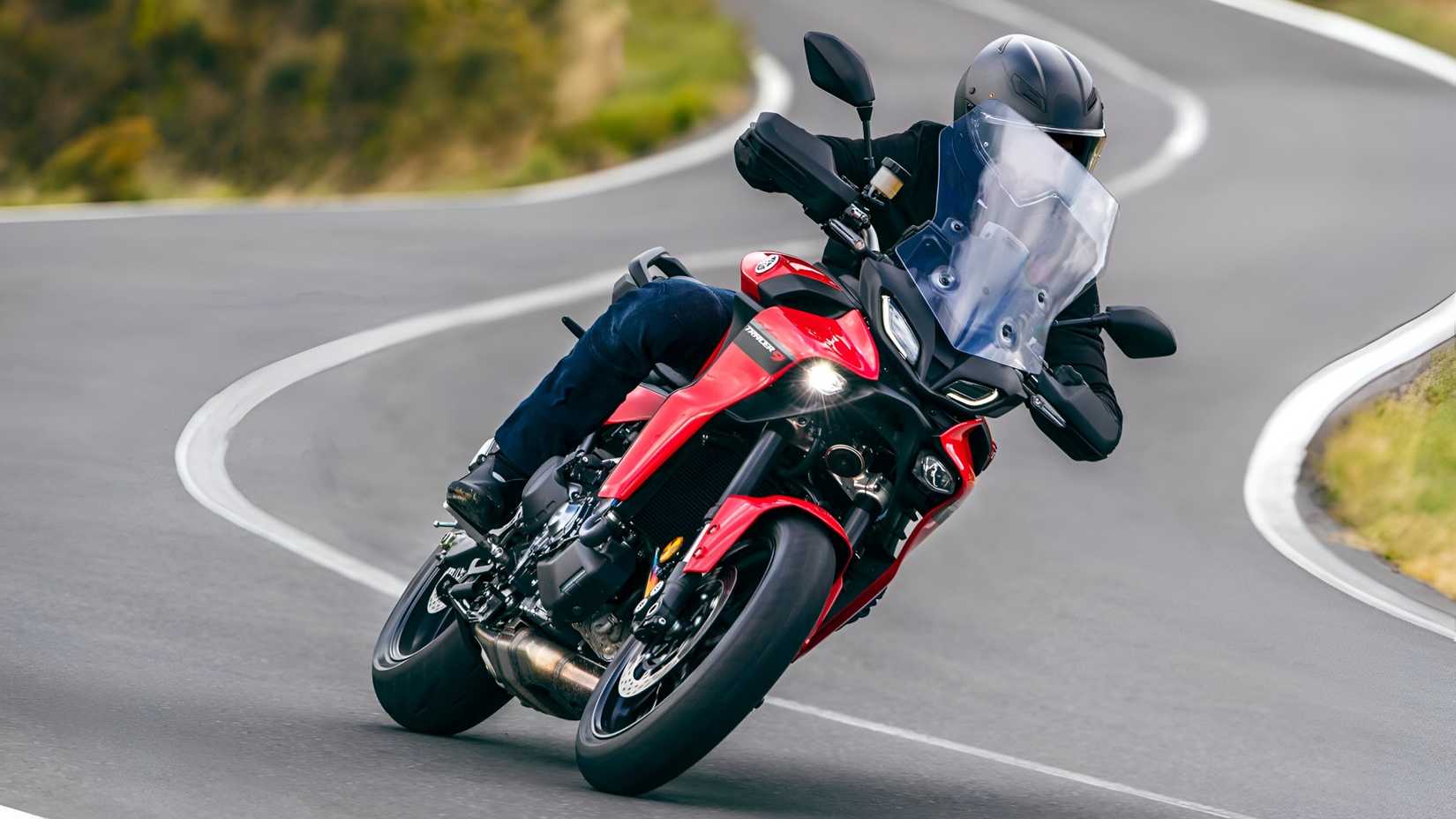 2025 Yamaha Tracer 9 touring bike cornering on winding road