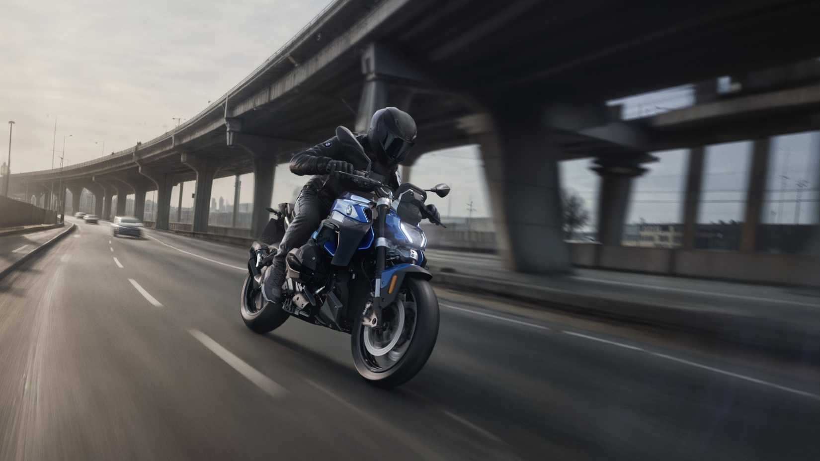 2026 BMW R 1300 R accelerating hard front third quarter view