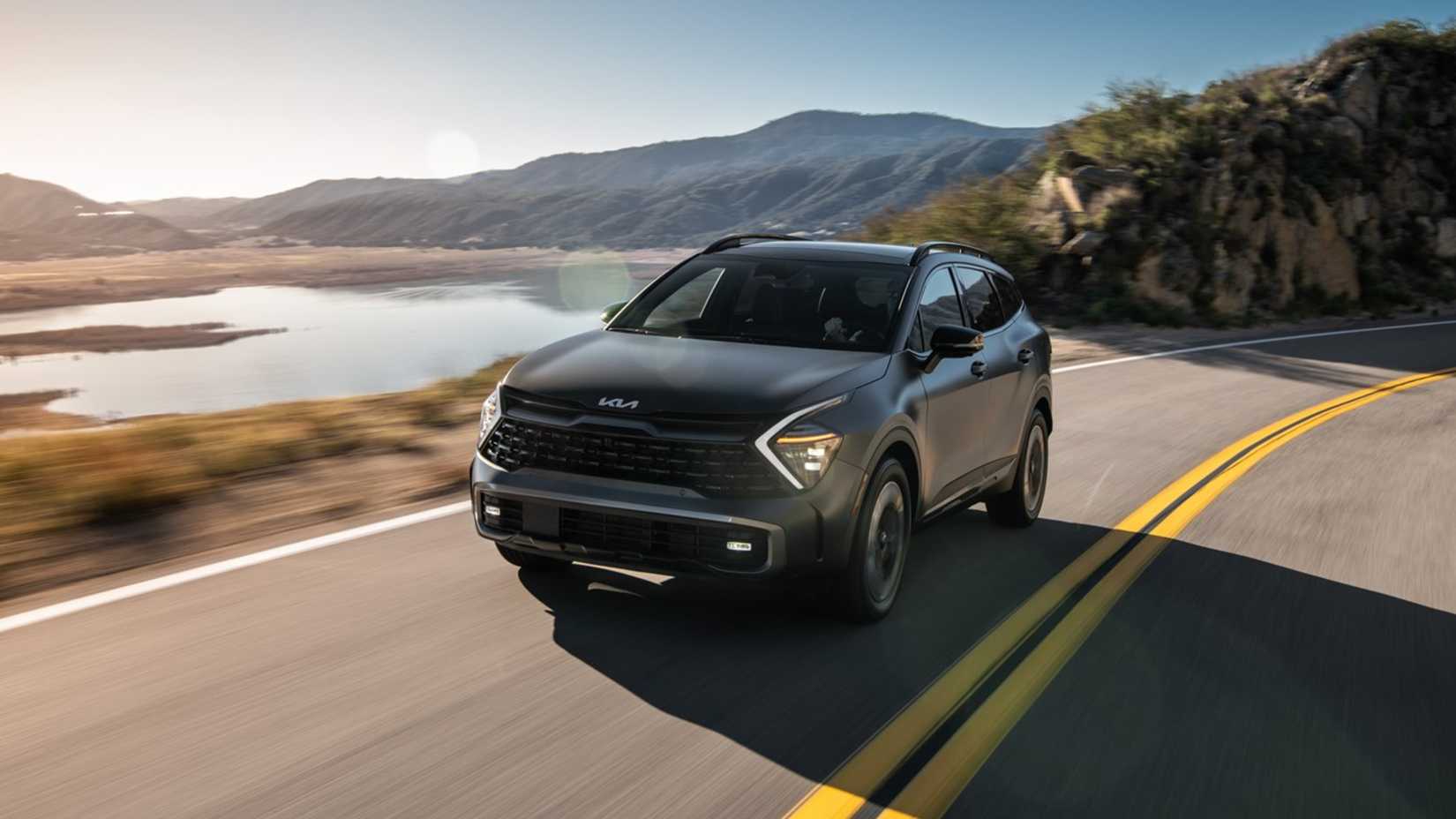 2025 Kia Sportage PHEV Exterior Driving Down Road