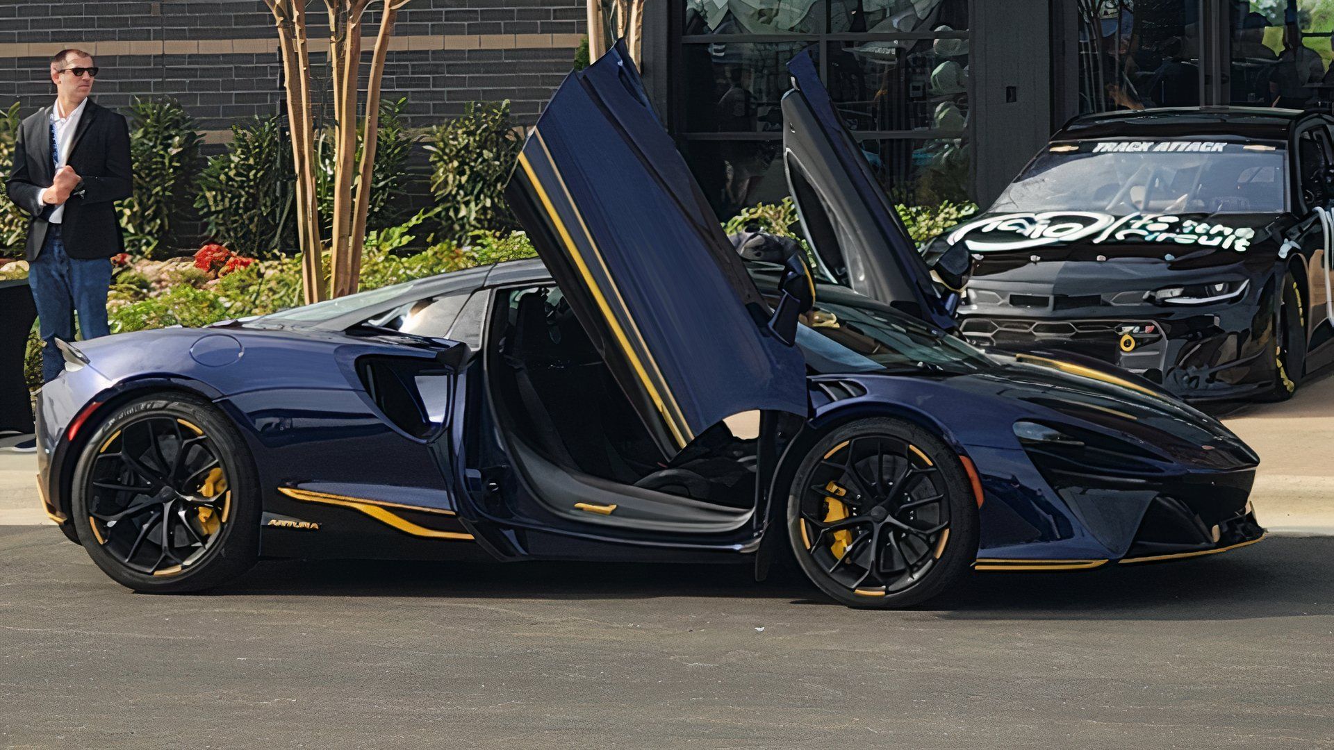 Blue McLaren Artura With Doors Up