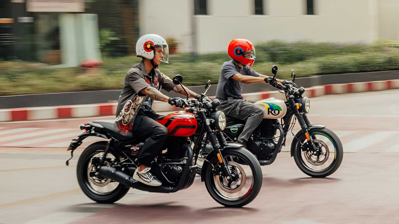 Two 2025 Royal Enfield Hunter 350s riding on the street