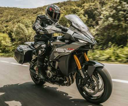 2025 Suzuki GSX-S1000GX+ accelerating front third quarter view