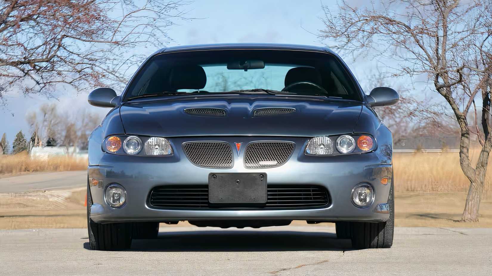 2005 Pontiac GTO in blue parked on road
