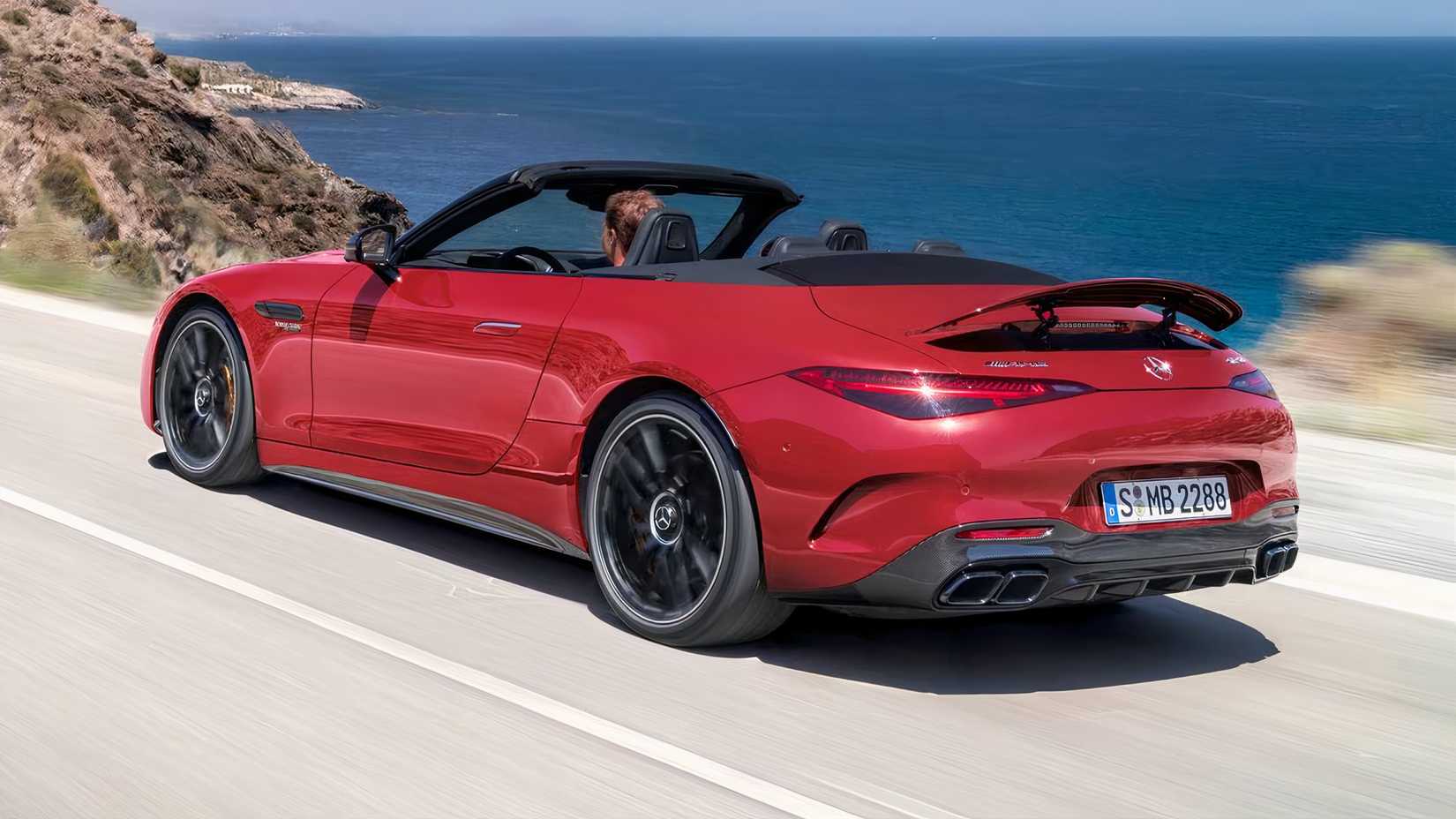 2025 Mercedes-AMG SL 63 in red driving on coast road