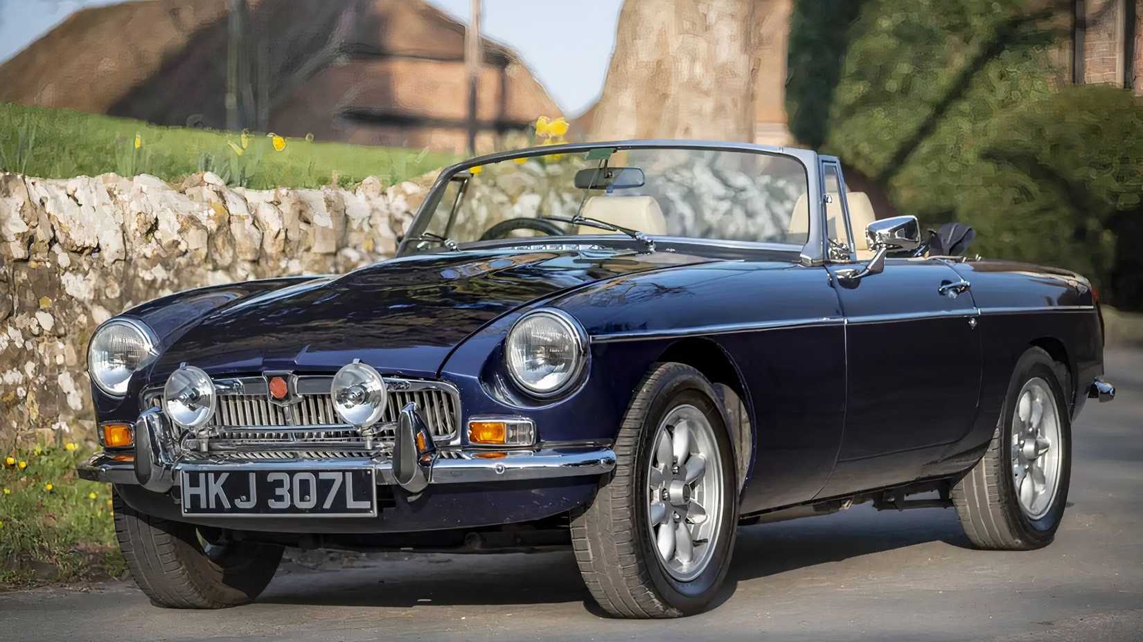 1973 MG B V8 Roadster in blue parked with roof down