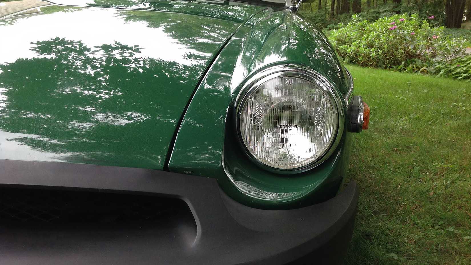 1975 MG B Roadster V8 front end showing headlight and bumper