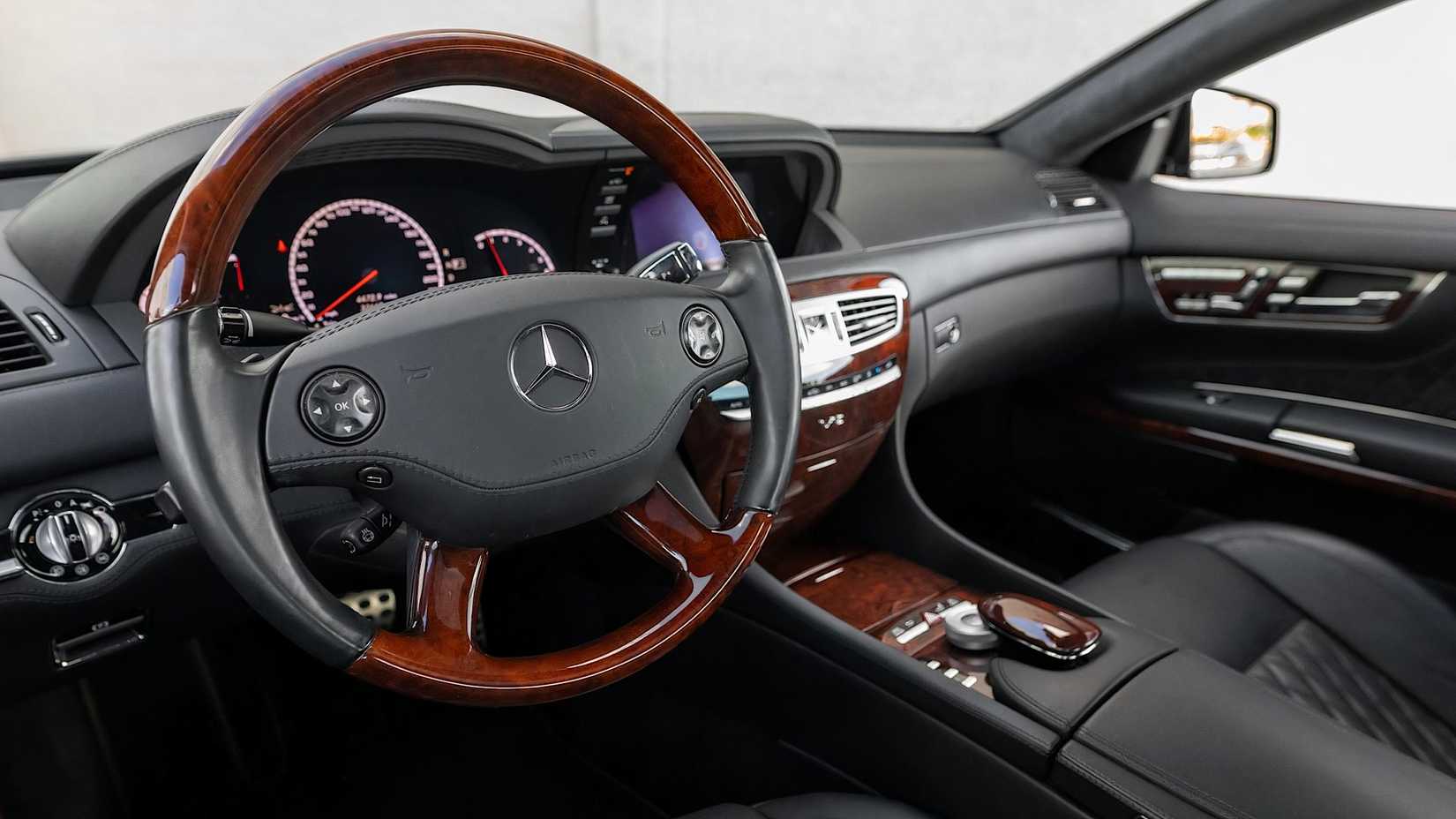 2010 Mercedes-Benz CL65 AMG interior showing steering wheel, dashboard, and controls