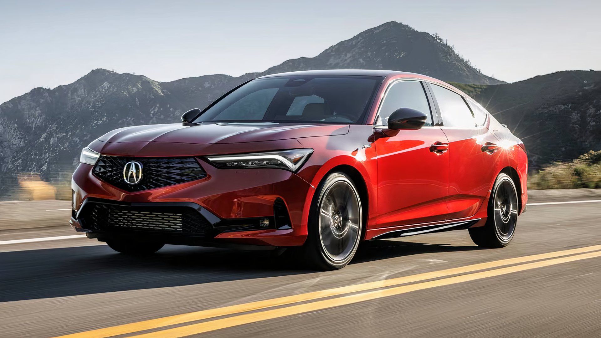 2025 Acura Integra in red driving on road