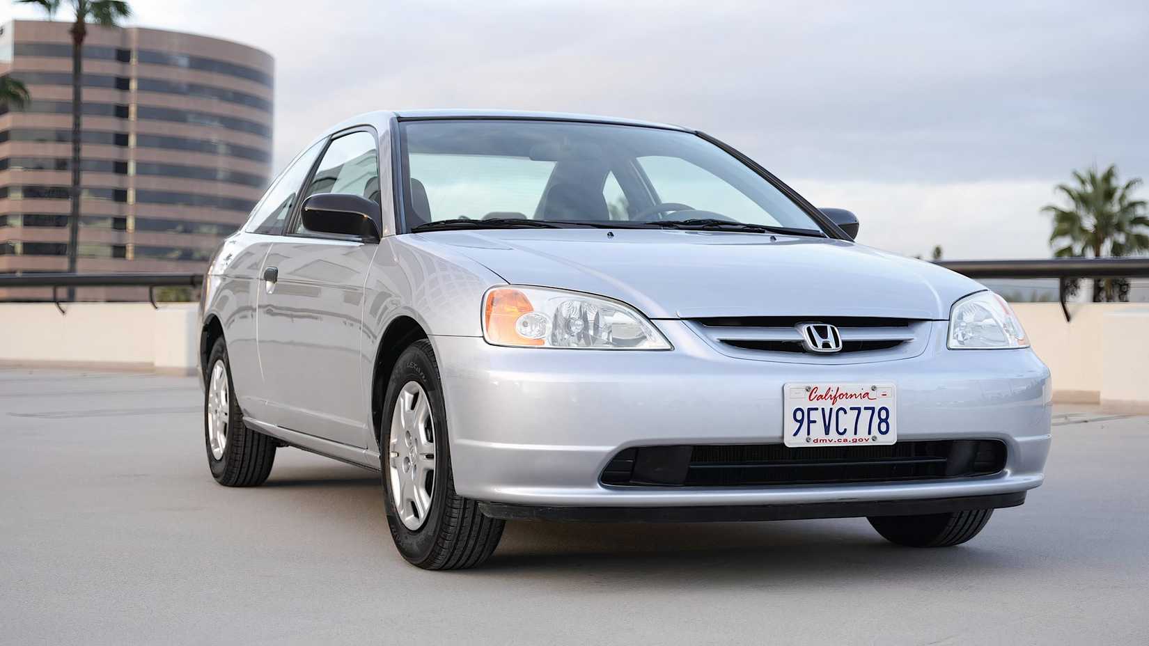 2001 Honda Civic sedan in silver parked in parking lot