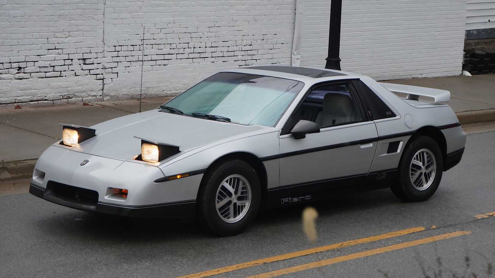 1987 Pontiac Fiero SE in silver parked on road