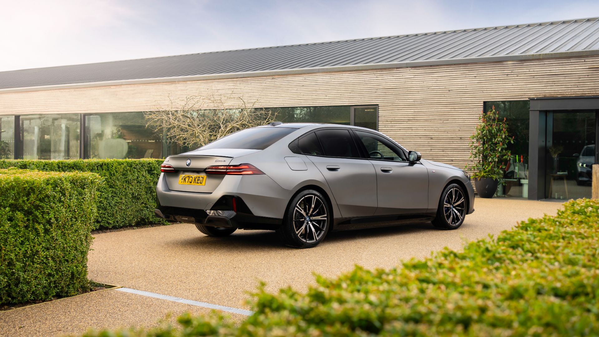 2025 BMW 550e Plug-In Hybrid Exterior Parked In Driveway