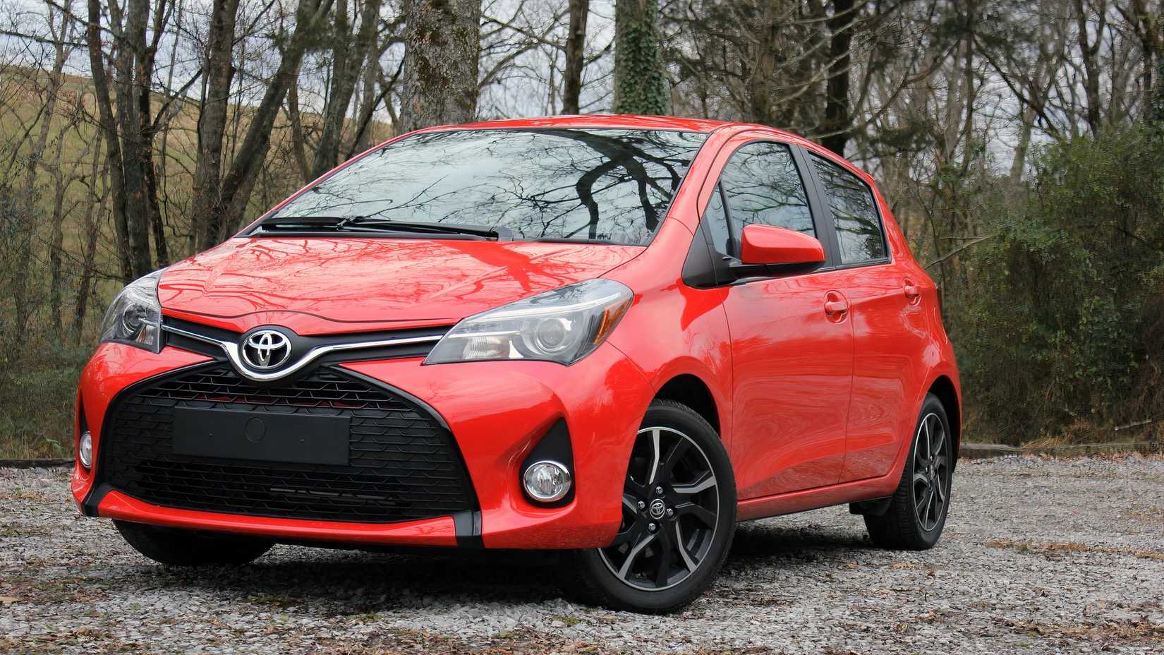 2015 Toyota Yaris front 3/4 shot parked on gravel road